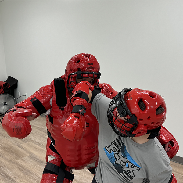 Woman Elbowing R.A.D. Trainer In The Face