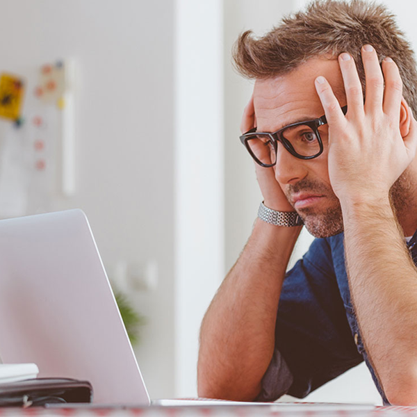 Stressed Man at a Computer