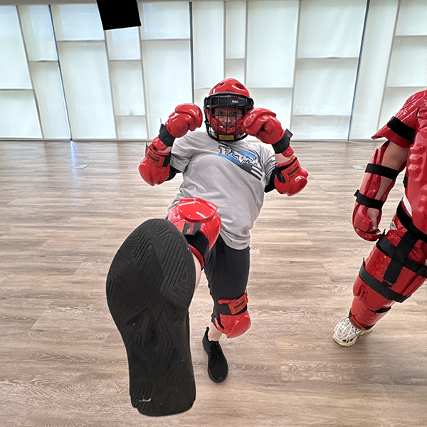 Woman Kicking In R.A.D. Gear